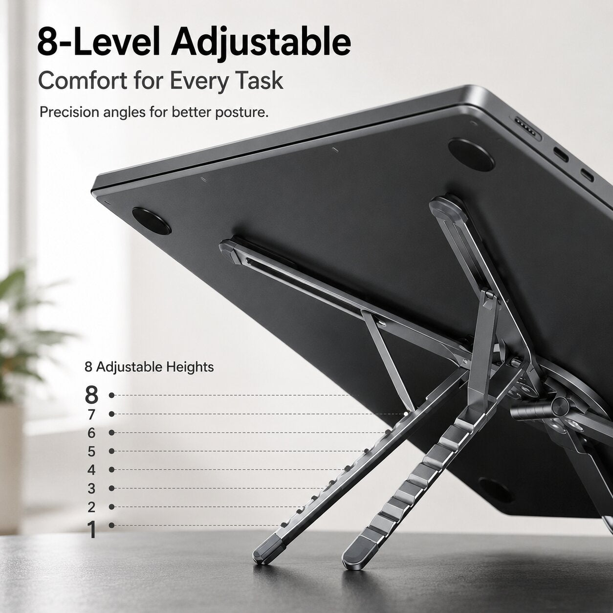 Adjustable aluminum laptop and tablet stand with 8 height levels for ergonomic viewing and comfortable posture.